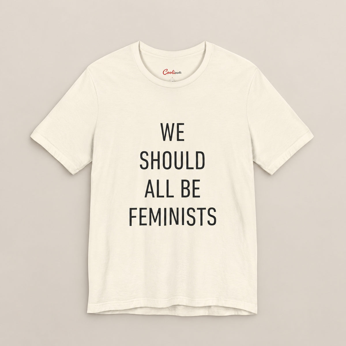 We Should All Be Feminists Bella+Canvas 3001 T-shirt in Natural, front flat lay.