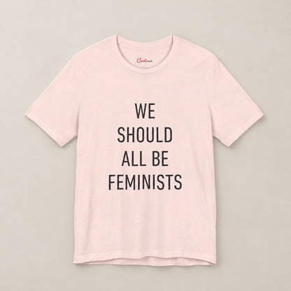 We Should All Be Feminists Bella+Canvas 3001 T-shirt in Soft Pink, front flat lay.