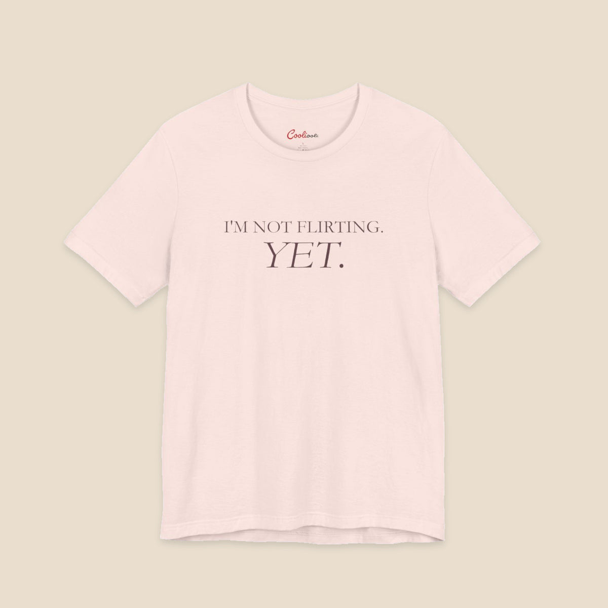 Soft Pink I'm Not Flirting Yet slogan T-shirt front