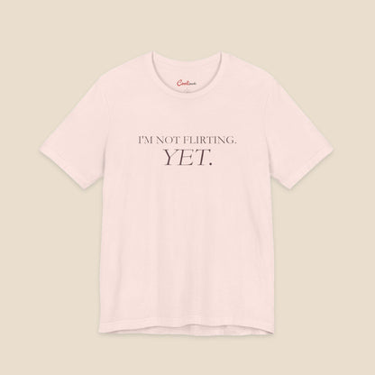 Soft Pink I'm Not Flirting Yet slogan T-shirt front