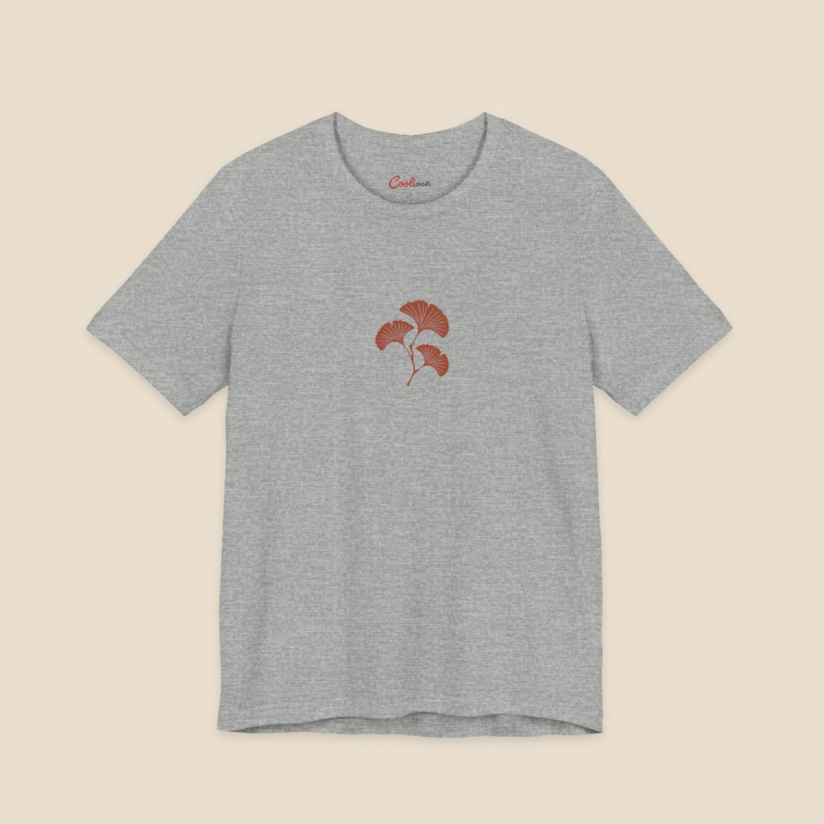 Athletic Heather Bella+Canvas 3001 T-shirt with an original small rust three-leaf ginkgo twig graphic.