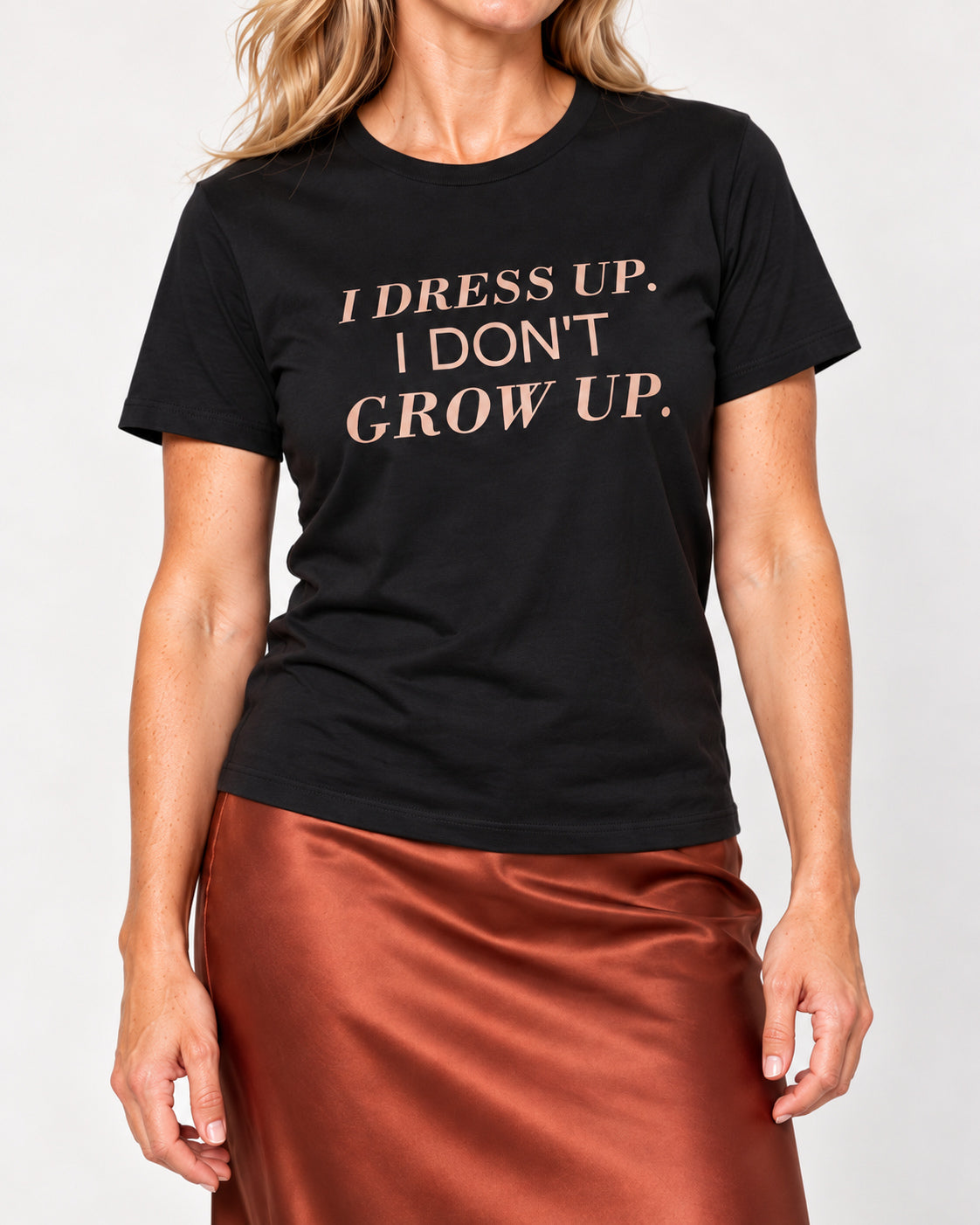 Elena wearing the Black I DRESS UP. I DON'T GROW UP. Bella+Canvas 3001 tee — collar-to-hip studio detail with print following fabric folds