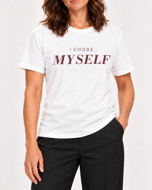 Sophie wearing the White Her First Choice. Bella+Canvas 3001 tee — collar-to-hip detail