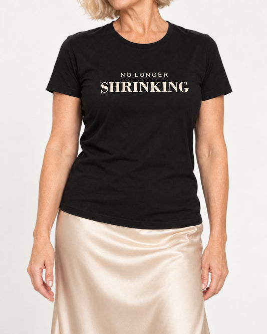 Claudia wearing the Black Her Presence Is the Point. Bella+Canvas 3001 tee — collar-to-hip detail