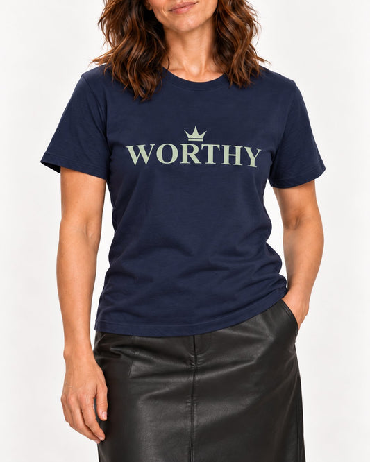 Sophie wearing the Navy Her Worth Was Never in Question. Bella+Canvas 3001 tee — collar-to-hip detail
