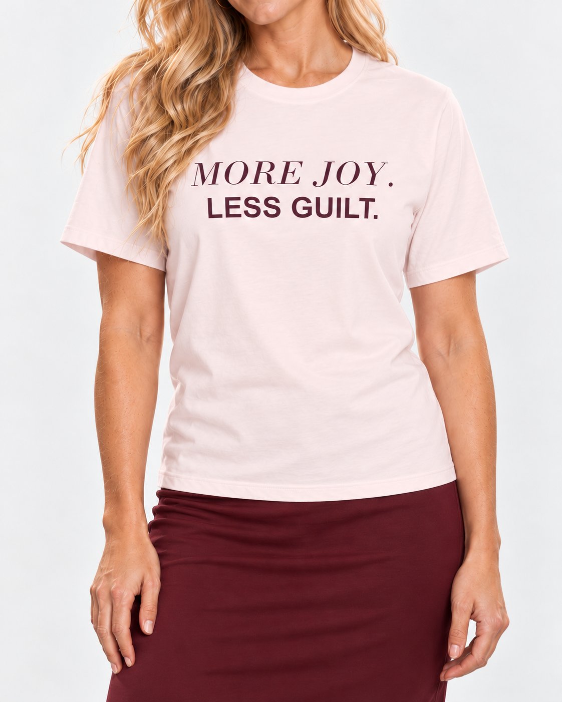 Chloe wearing the Soft Pink She Deserves the Good Bit. Bella+Canvas 3001 tee — collar-to-hip detail