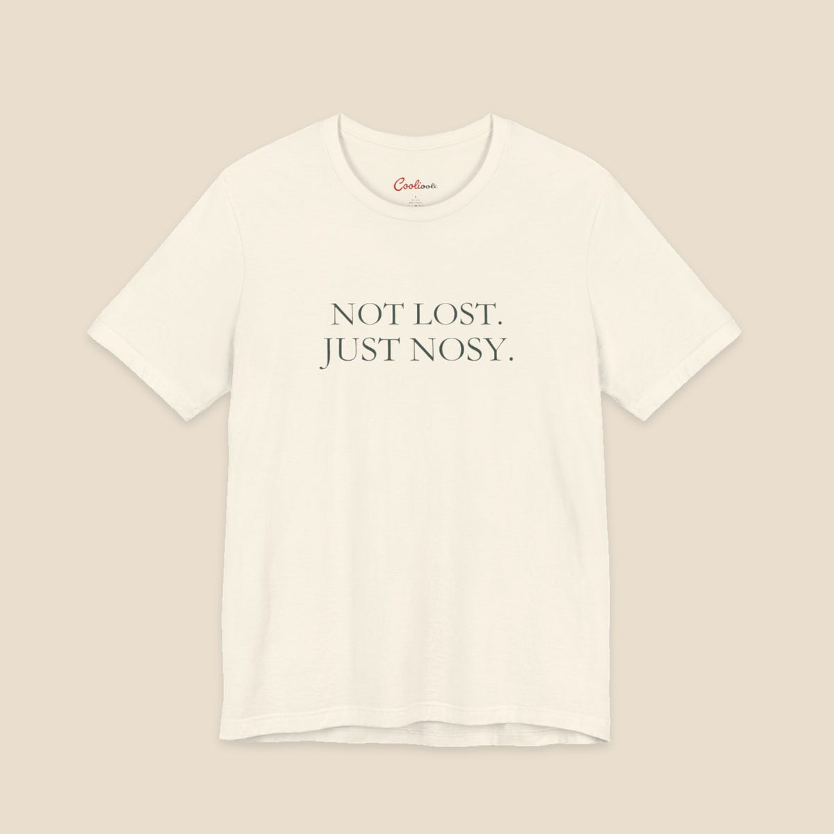 Natural Bella+Canvas3001 T-shirt with the two-line Not Lost. Just Nosy. chest design.