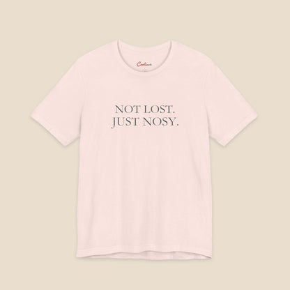 Soft Pink Bella+Canvas3001 T-shirt with the two-line Not Lost. Just Nosy. chest design.