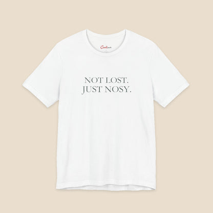 White Bella+Canvas3001 T-shirt with the two-line Not Lost. Just Nosy. chest design.