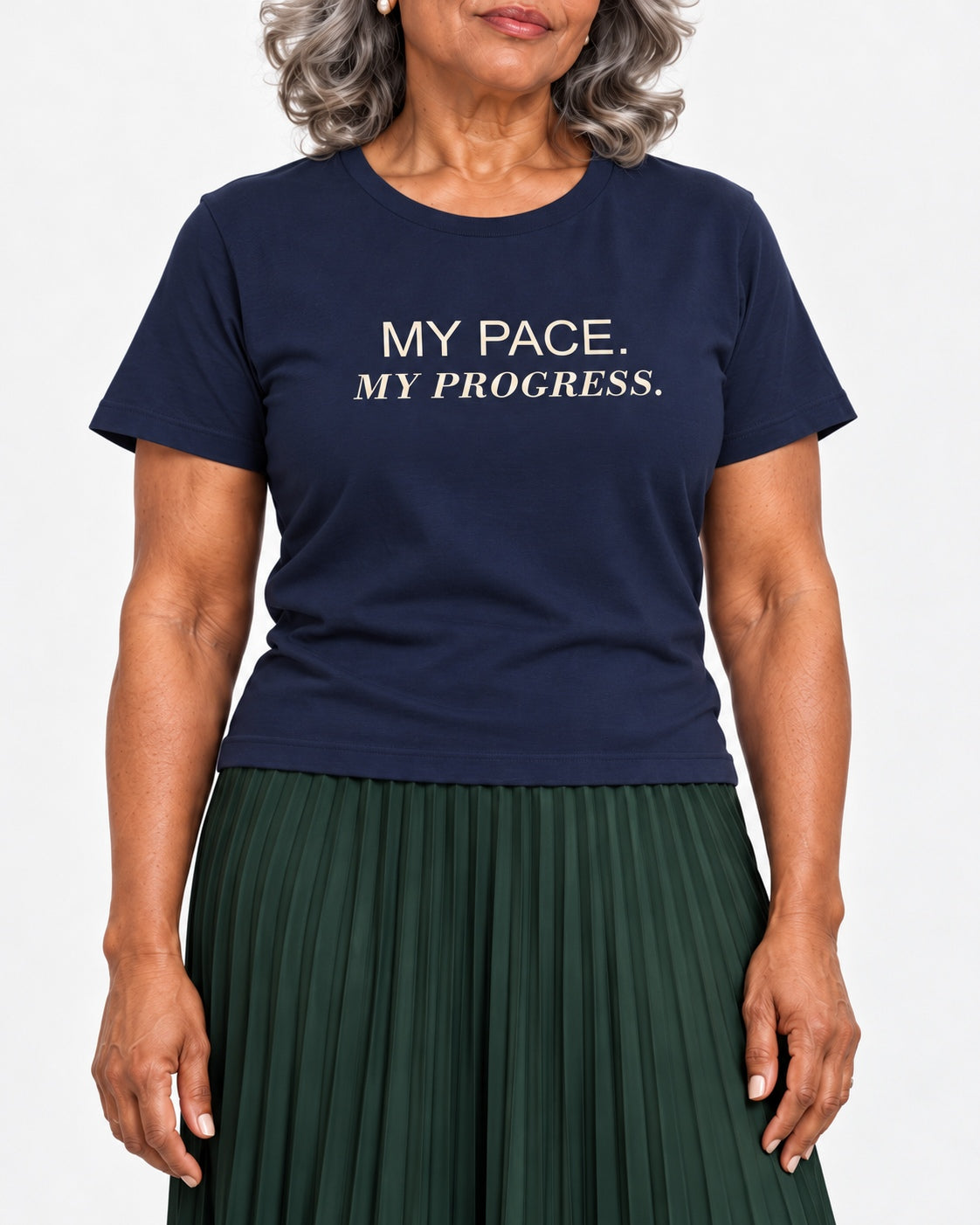 Vivienne wearing the Navy MY PACE. MY PROGRESS. Bella+Canvas 3001 tee — collar-to-hip studio detail showing the print following fabric folds