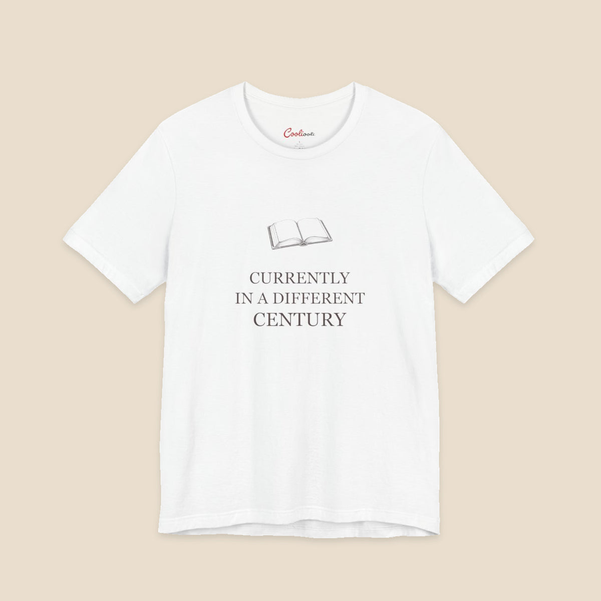 White Bella+Canvas 3001 reader T-shirt with an original open-book illustration and Currently in a Different Century lettering.