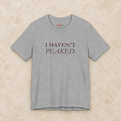 I Haven't Peaked Bella+Canvas 3001 T-shirt in Athletic Heather, front flat lay.