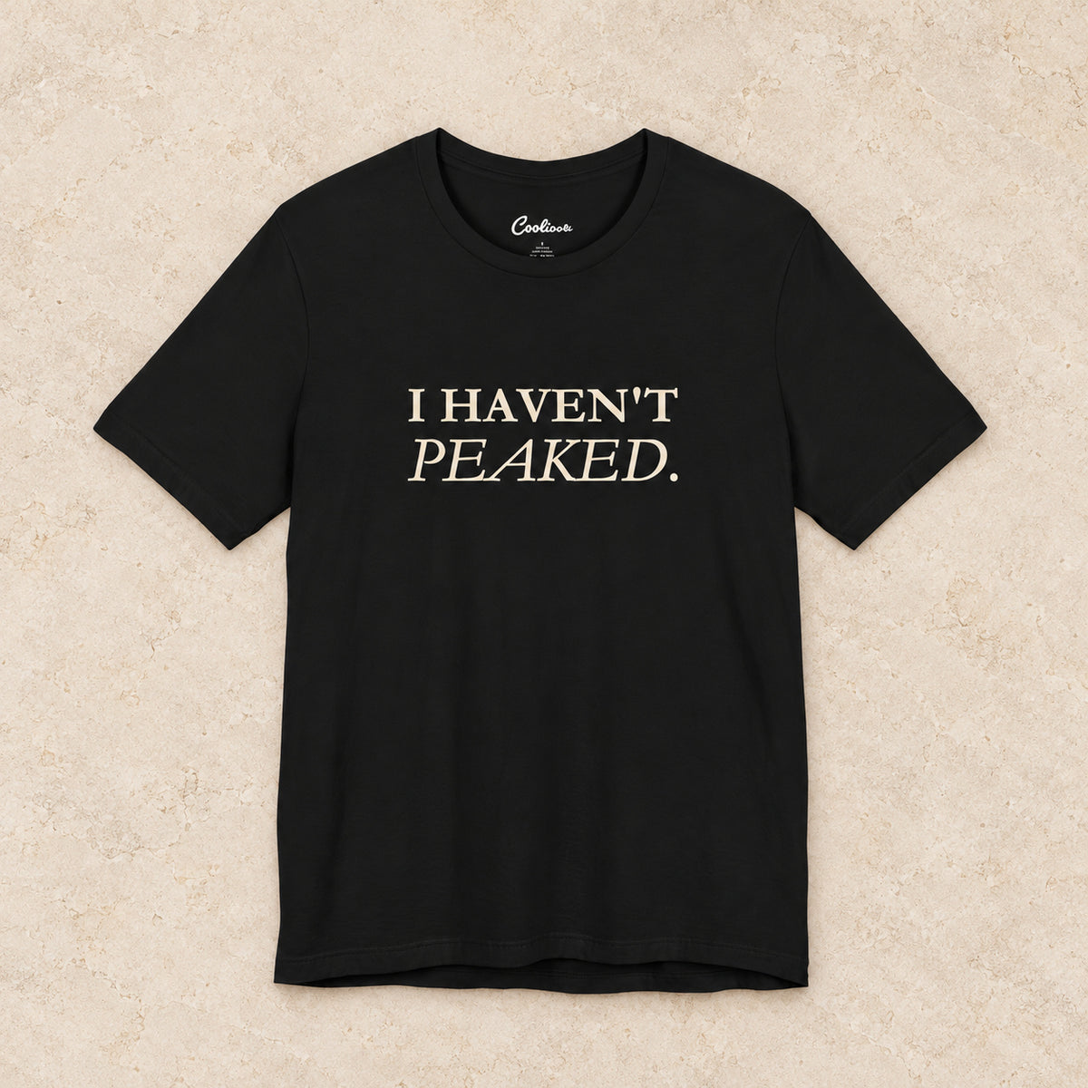 I Haven't Peaked Bella+Canvas 3001 T-shirt in Black, front flat lay.