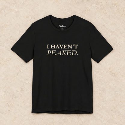 I Haven't Peaked Bella+Canvas 3001 T-shirt in Black, front flat lay.