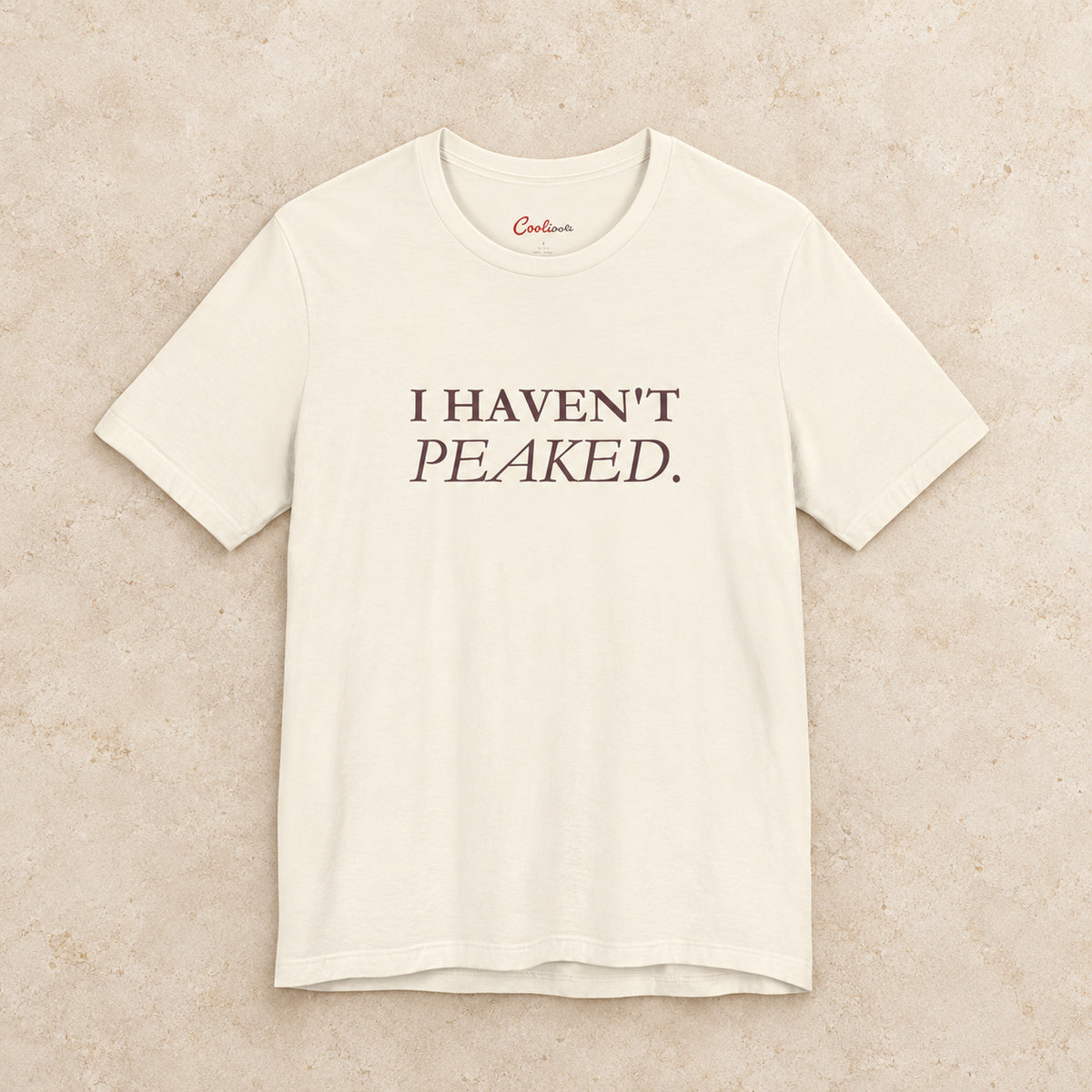 I Haven't Peaked Bella+Canvas 3001 T-shirt in Natural, front flat lay.