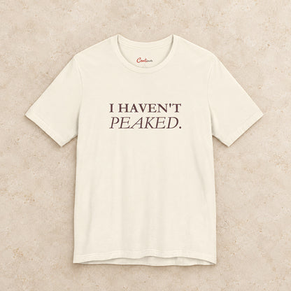 I Haven't Peaked Bella+Canvas 3001 T-shirt in Natural, front flat lay.