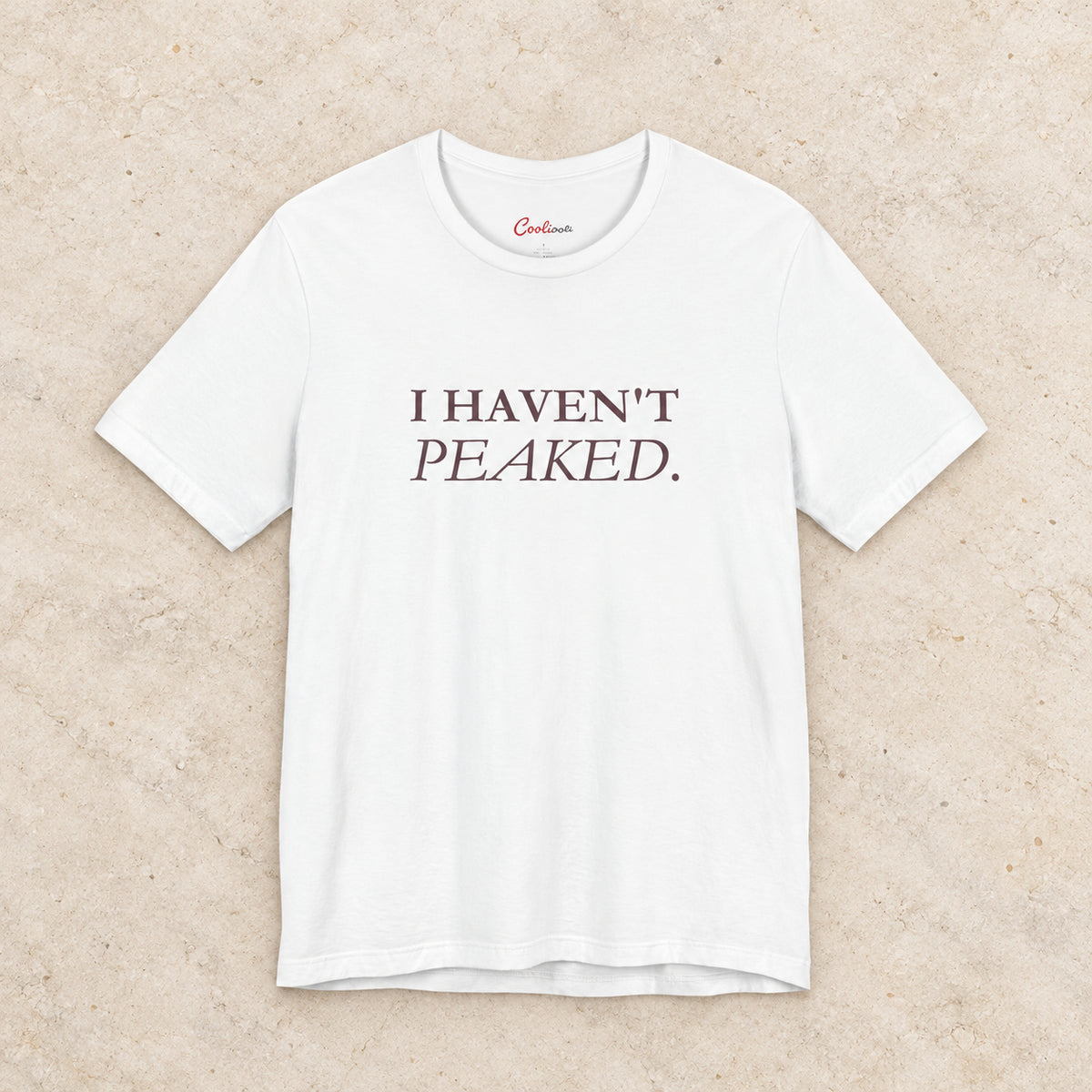 I Haven't Peaked Bella+Canvas 3001 T-shirt in White, front flat lay.