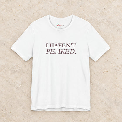 I Haven't Peaked Bella+Canvas 3001 T-shirt in White, front flat lay.