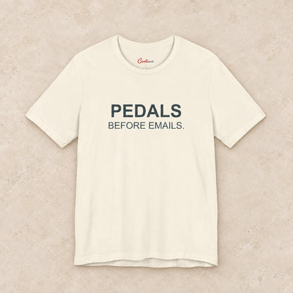 Pedals Before Emails. Bella+Canvas3001 T-shirt in Natural, front flat lay.