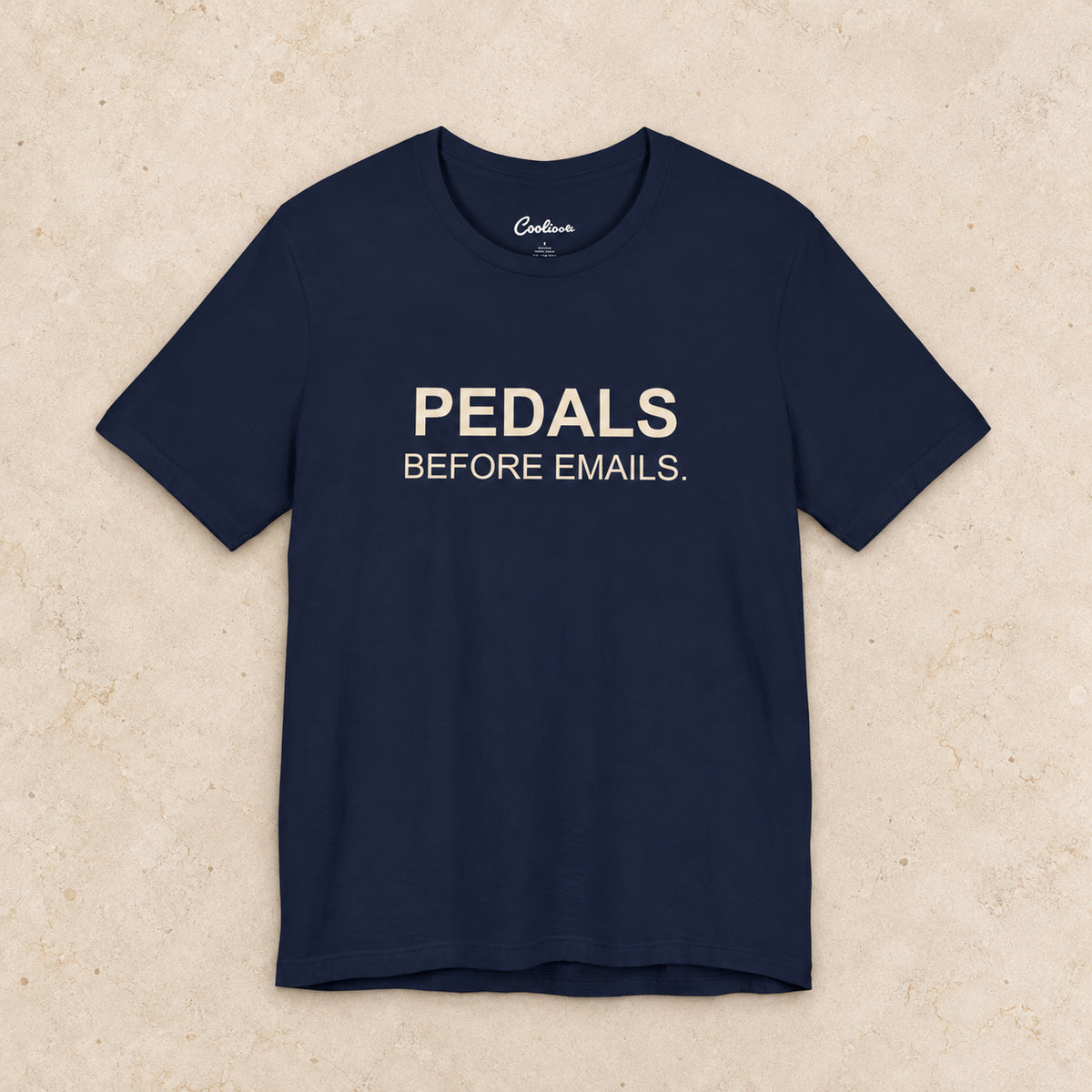 Pedals Before Emails. Bella+Canvas3001 T-shirt in Navy, front flat lay.