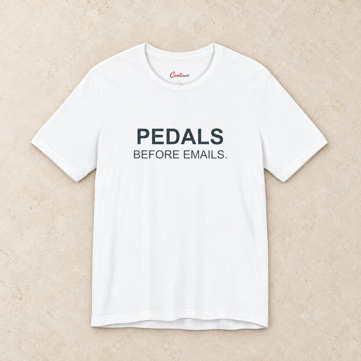 Pedals Before Emails. Bella+Canvas3001 T-shirt in White, front flat lay.