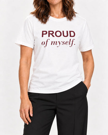 Sophie wearing the White She Earned That Smile. Bella+Canvas 3001 tee — collar-to-hip detail with ink following fabric folds