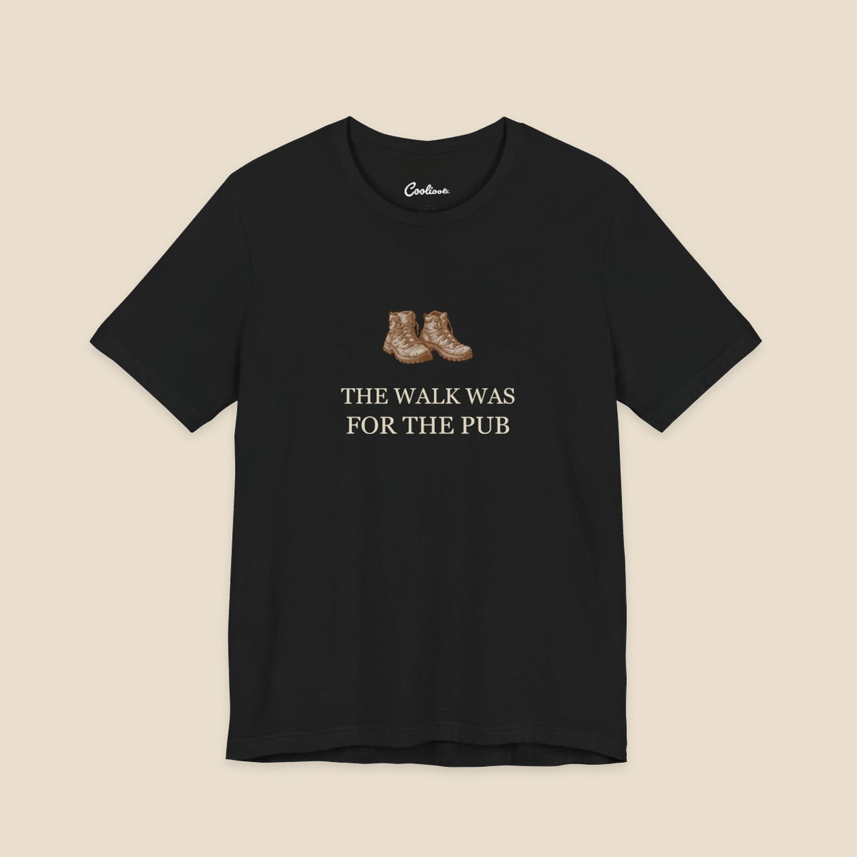 Black Bella+Canvas3001 T-shirt with a brown hiking boots graphic and The Walk Was for the Pub serif lettering.