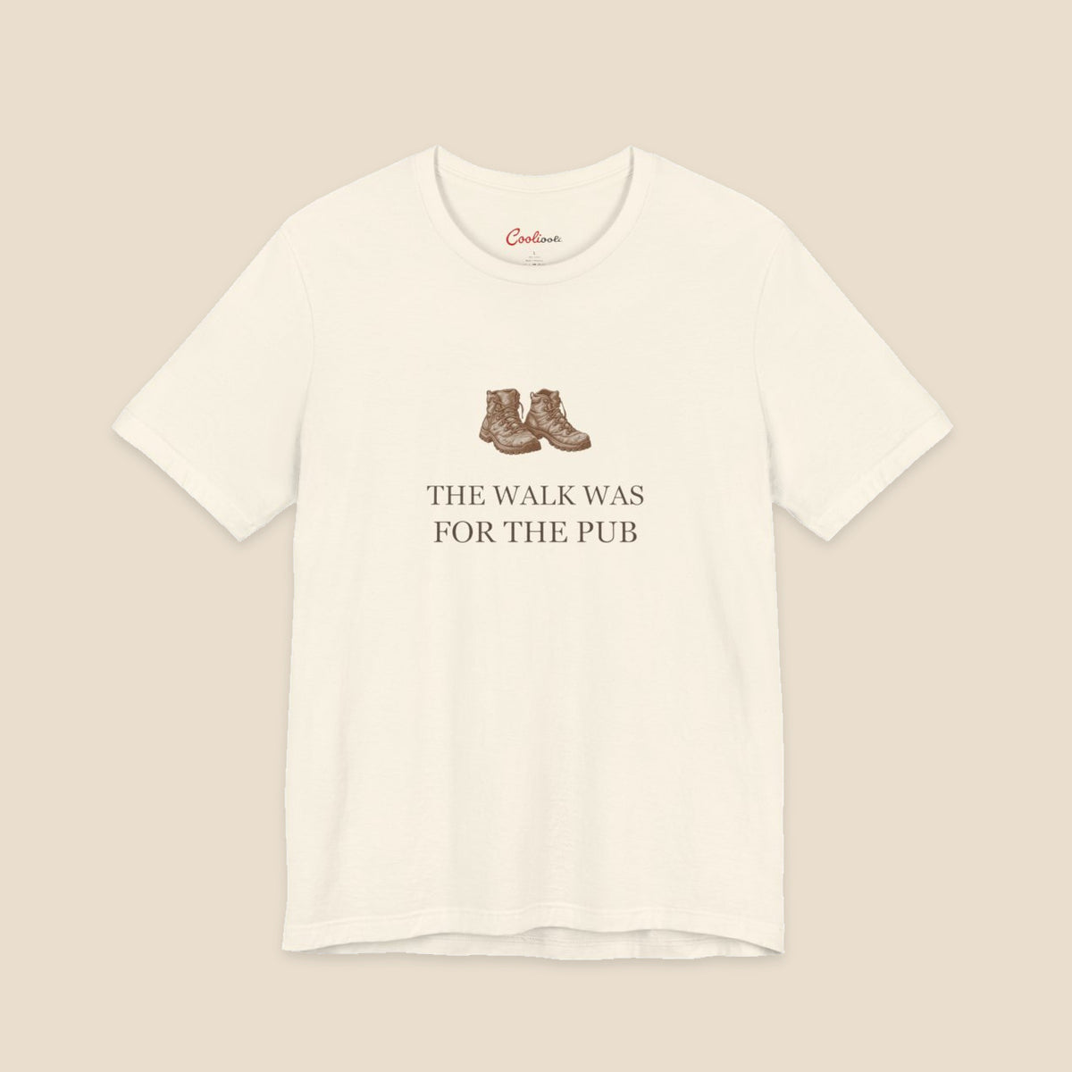 Natural Bella+Canvas3001 T-shirt with a brown hiking boots graphic and The Walk Was for the Pub serif lettering.