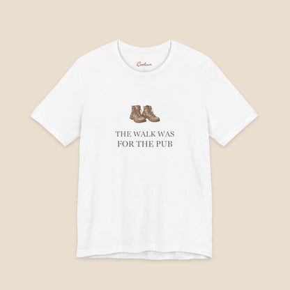 White Bella+Canvas3001 T-shirt with a brown hiking boots graphic and The Walk Was for the Pub serif lettering.