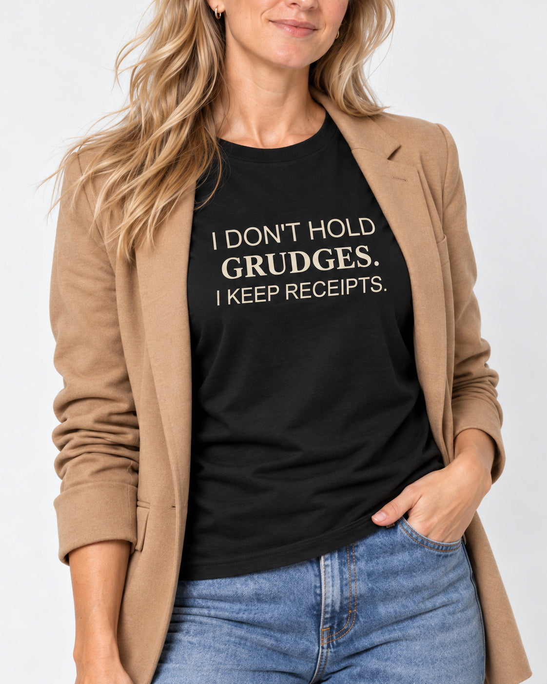 Close-up of I Don't Hold Grudges. I Keep Receipts. printed on the Black Bella+Canvas3001 T-shirt.