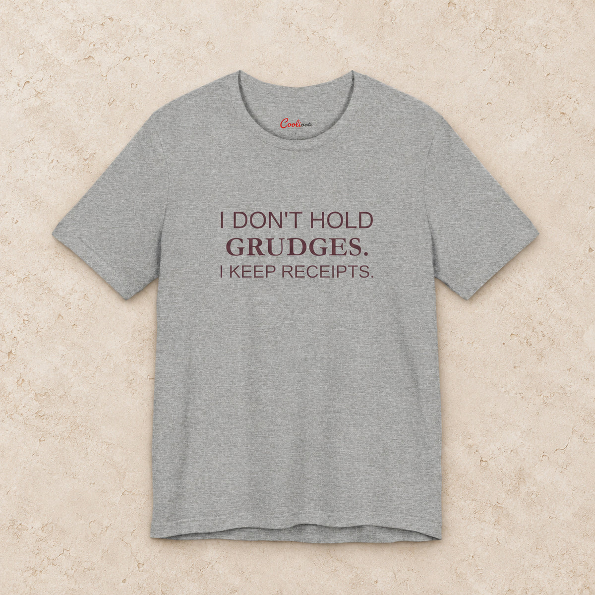 I Don't Hold Grudges. I Keep Receipts. Bella+Canvas3001 T-shirt in Athletic Heather, front flat lay.