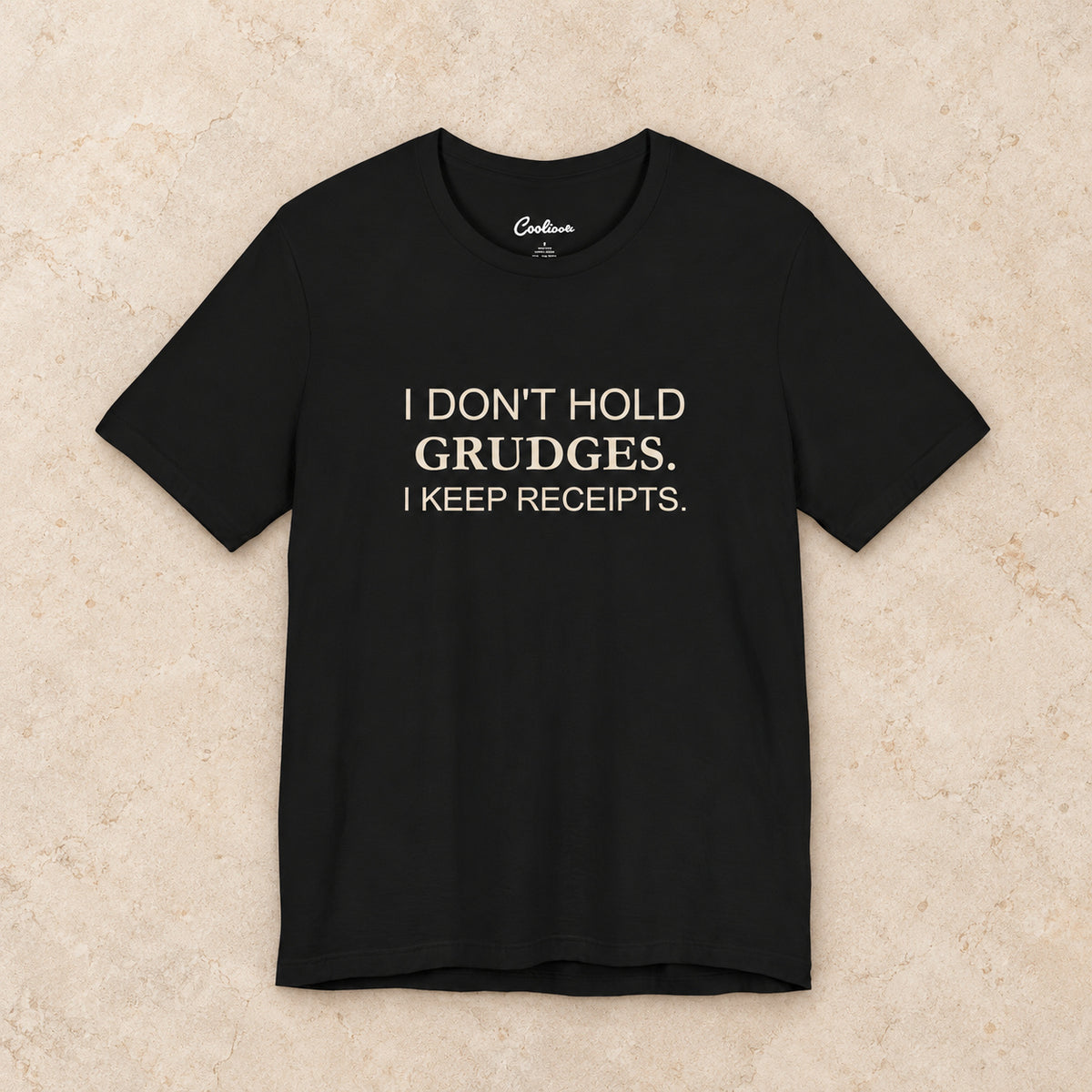 I Don't Hold Grudges. I Keep Receipts. Bella+Canvas3001 T-shirt in Black, front flat lay.