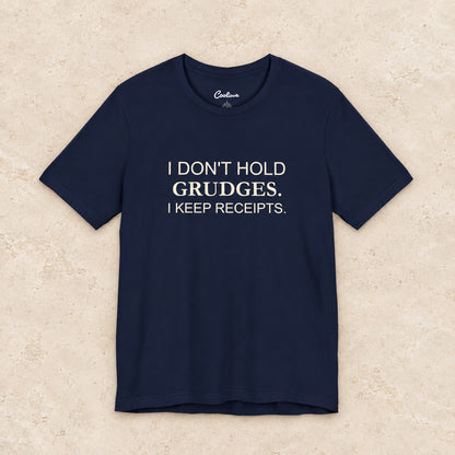 I Don't Hold Grudges. I Keep Receipts. Bella+Canvas3001 T-shirt in Navy, front flat lay.