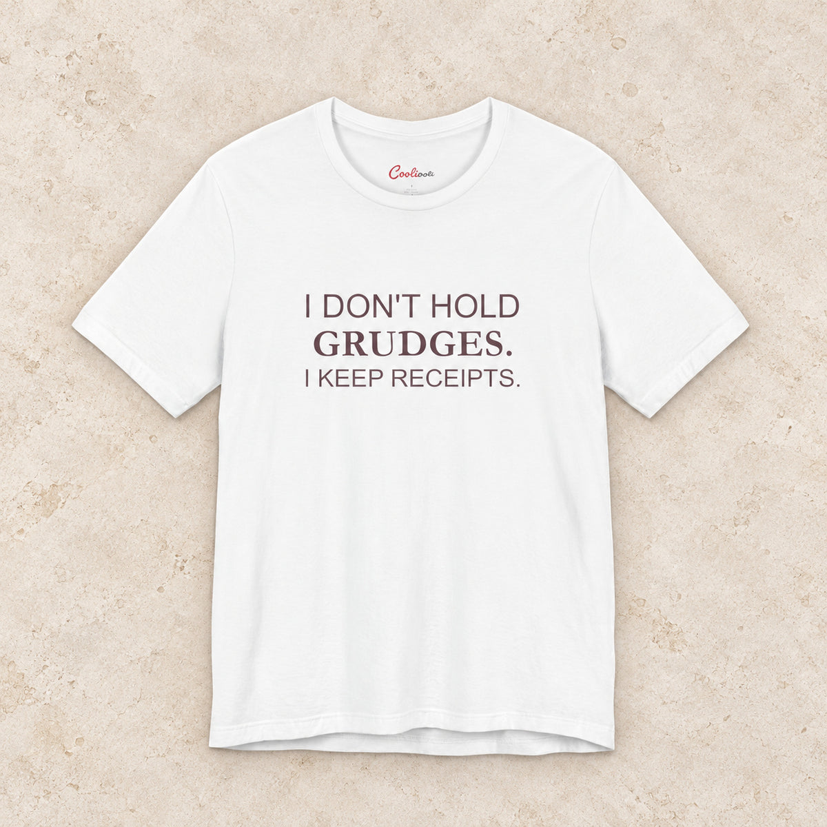 I Don't Hold Grudges. I Keep Receipts. Bella+Canvas3001 T-shirt in White, front flat lay.