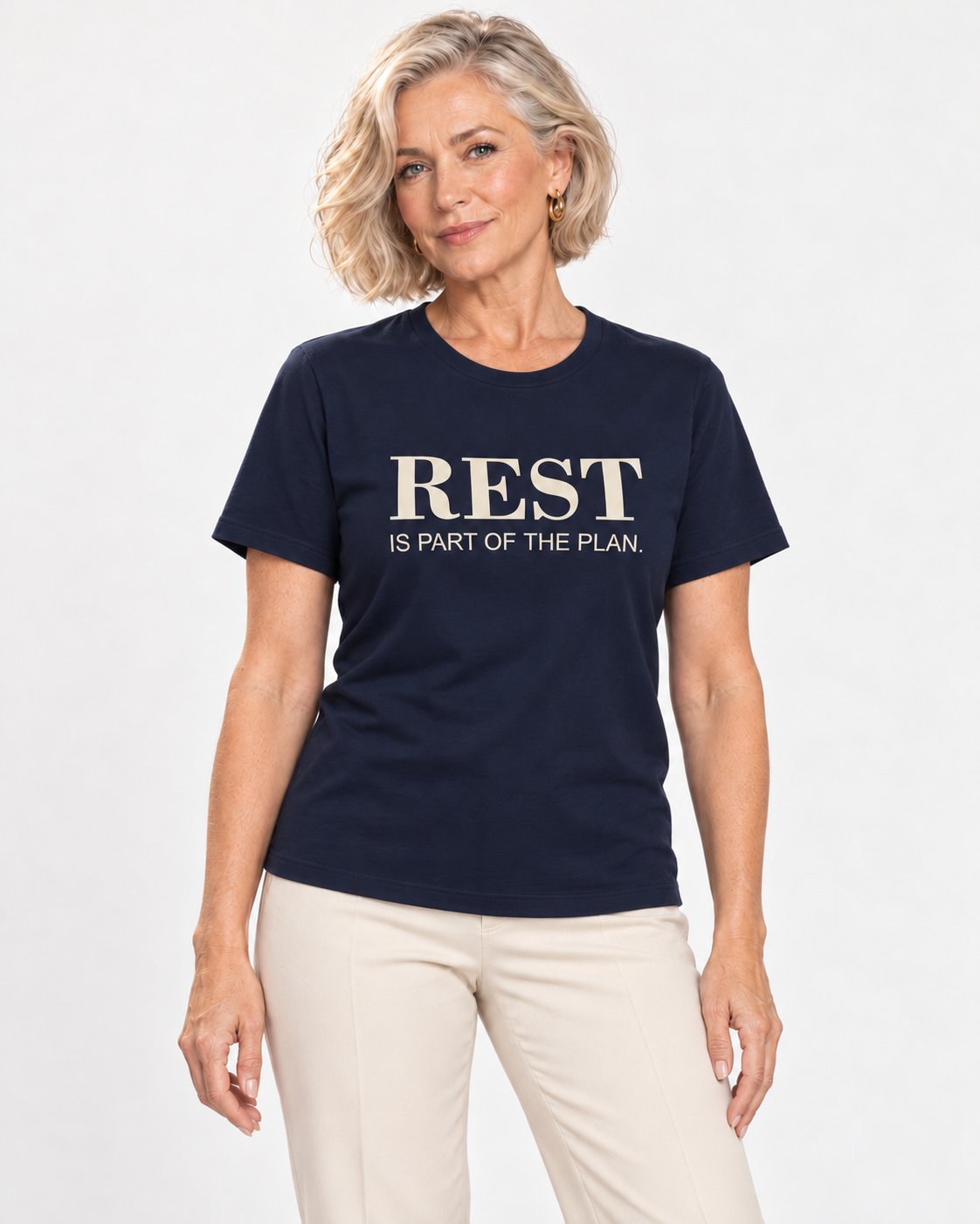 Claudia wearing the Navy Her Time Off Is Well Spent. Bella+Canvas 3001 tee — natural studio portrait