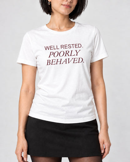 Close-up of WELL RESTED. POORLY BEHAVED. printed on the White Bella+Canvas3001 T-shirt.