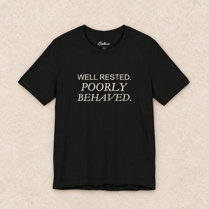 WELL RESTED. POORLY BEHAVED. Bella+Canvas3001 T-shirt in Black, front flat lay.