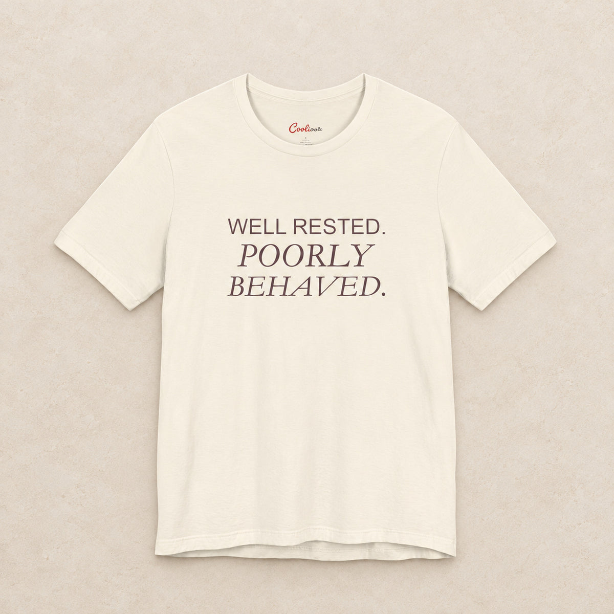 WELL RESTED. POORLY BEHAVED. Bella+Canvas3001 T-shirt in Natural, front flat lay.