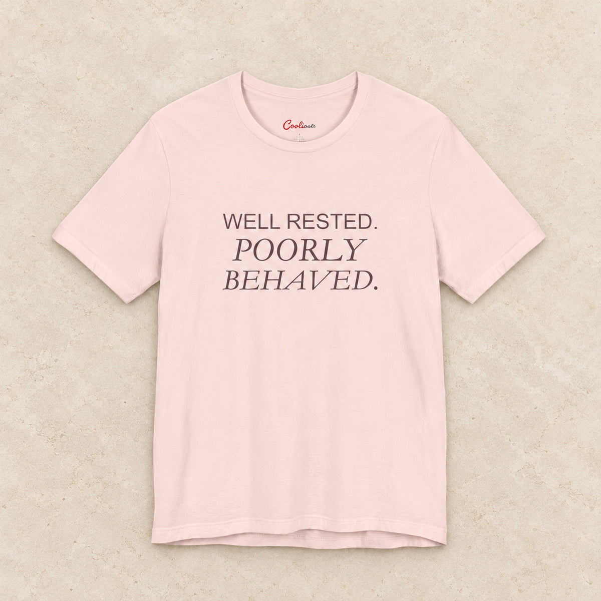 WELL RESTED. POORLY BEHAVED. Bella+Canvas3001 T-shirt in Soft Pink, front flat lay.