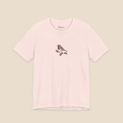 Soft Pink Bella+Canvas3001 Christmas T-shirt with an original small robin and holly illustration, no lettering.
