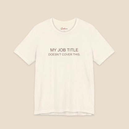Natural Bella+Canvas 3001 work humour T-shirt with two-line My Job Title Doesn’t Cover This lettering.