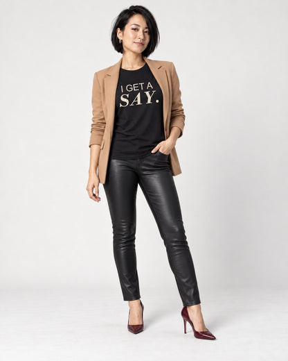 Mina wearing the Black I GET A SAY. Bella+Canvas 3001 tee — full-length natural studio outfit