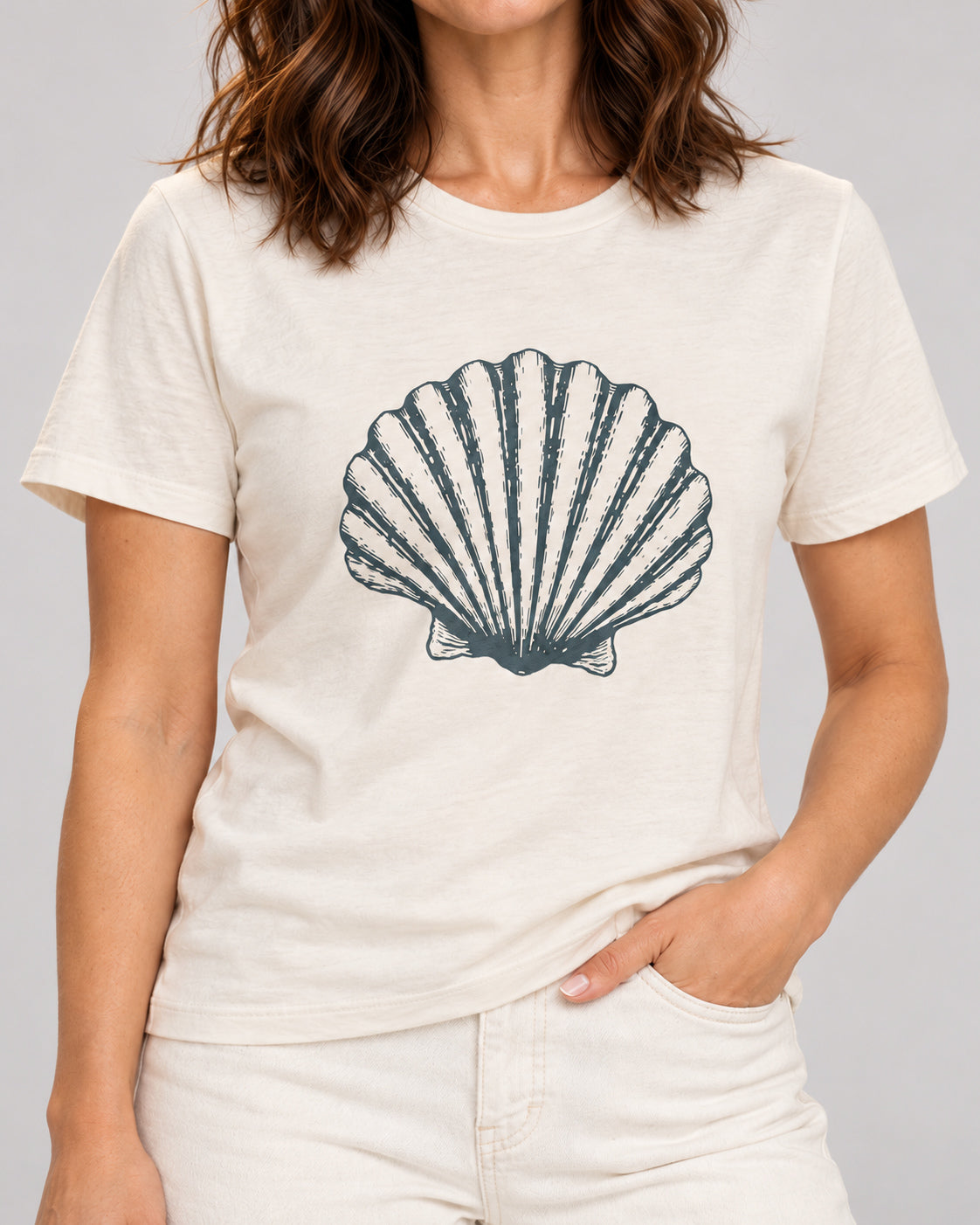Close-up of Original scallop shell printed on the Natural Bella+Canvas3001 T-shirt.