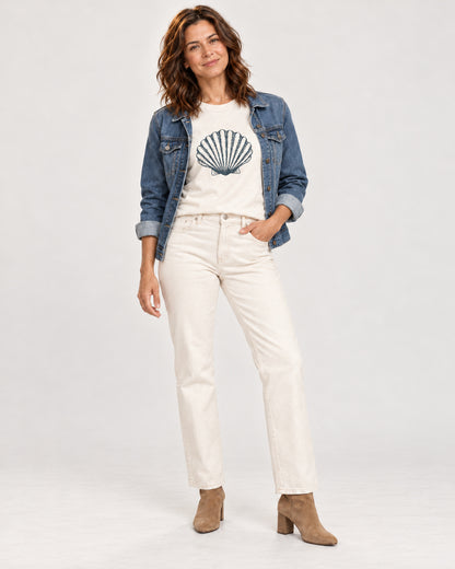 Sophie wearing the Natural Original scallop shell Bella+Canvas3001 T-shirt with an open blue denim jacket, cream straight-leg jeans and tan ankle boots.