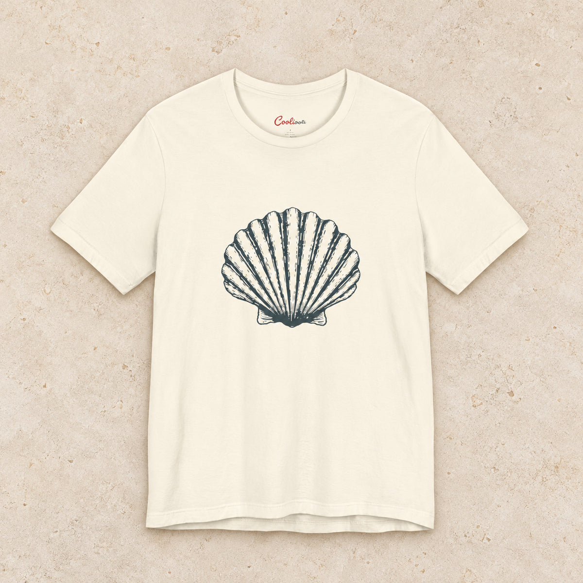 Original scallop shell Bella+Canvas3001 T-shirt in Natural, front flat lay.