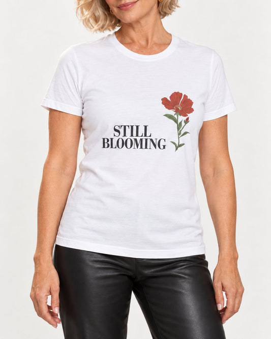 Claudia wearing the White Still Coming Into Her Own. Bella+Canvas 3001 tee — collar-to-hip detail