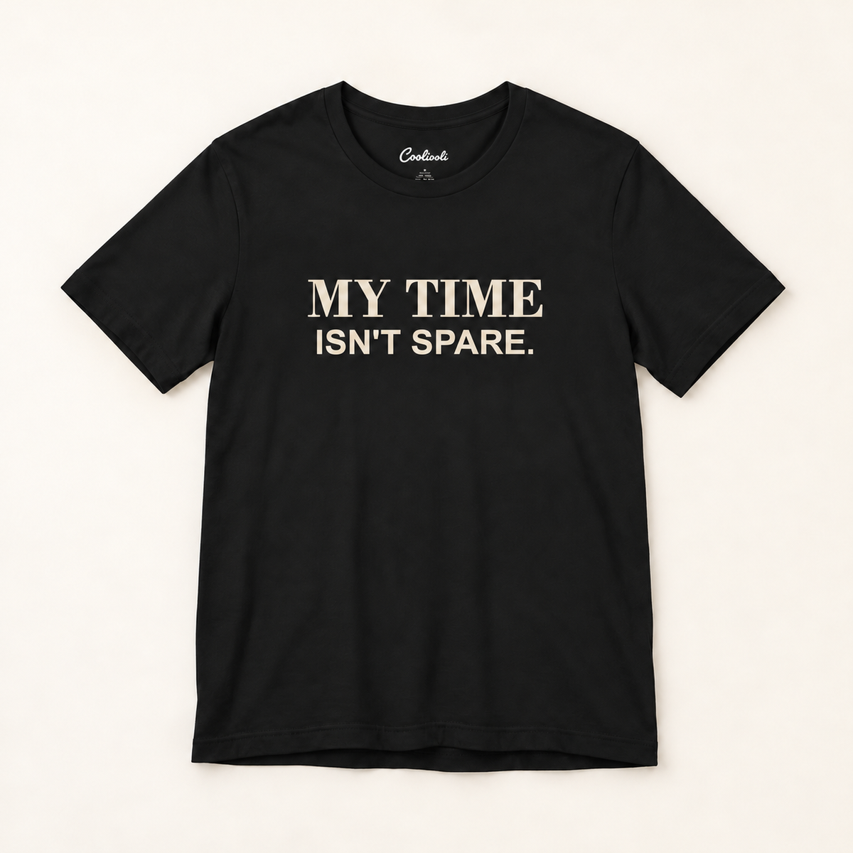 MY TIME ISN'T SPARE. Bella+Canvas 3001 tee in Black, overhead view on a plain warm neutral studio background