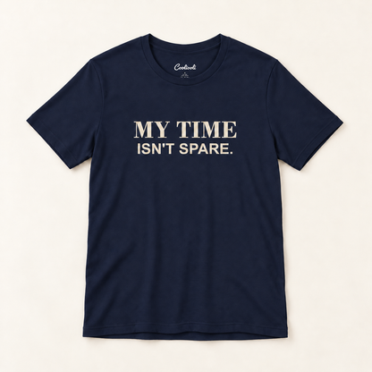 MY TIME ISN'T SPARE. Bella+Canvas 3001 tee in Navy, overhead view on a plain warm neutral studio background