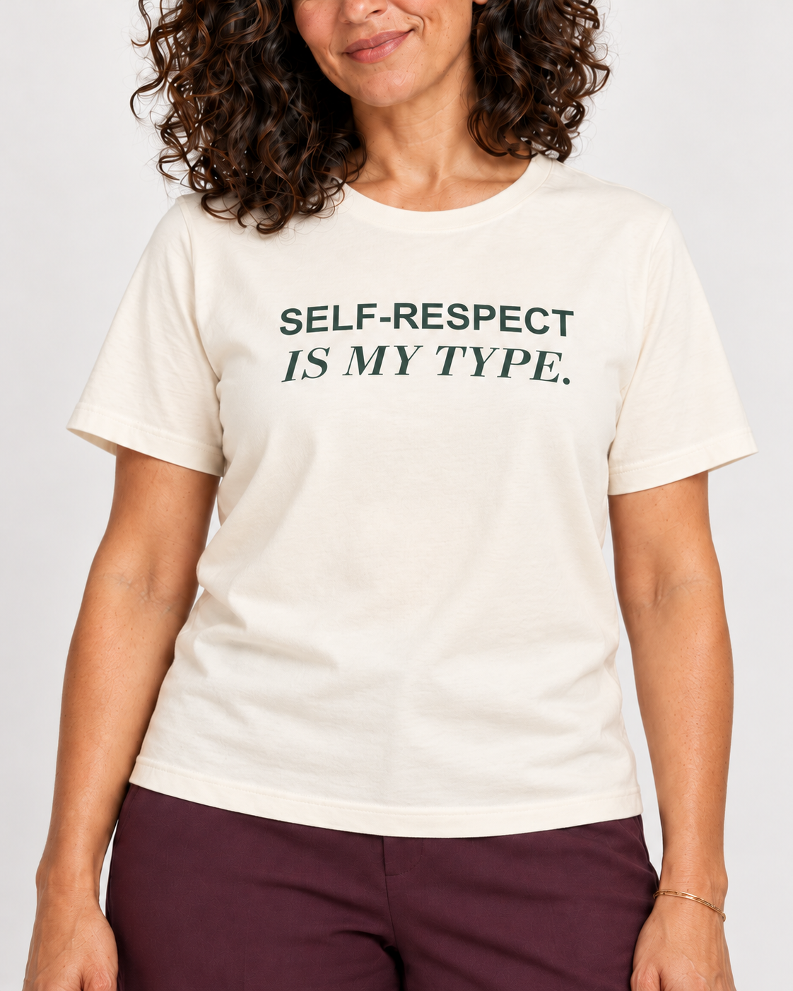 Leila wearing the Natural SELF-RESPECT IS MY TYPE. Bella+Canvas 3001 tee — collar-to-hip print detail