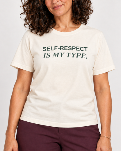 Leila wearing the Natural SELF-RESPECT IS MY TYPE. Bella+Canvas 3001 tee — collar-to-hip print detail